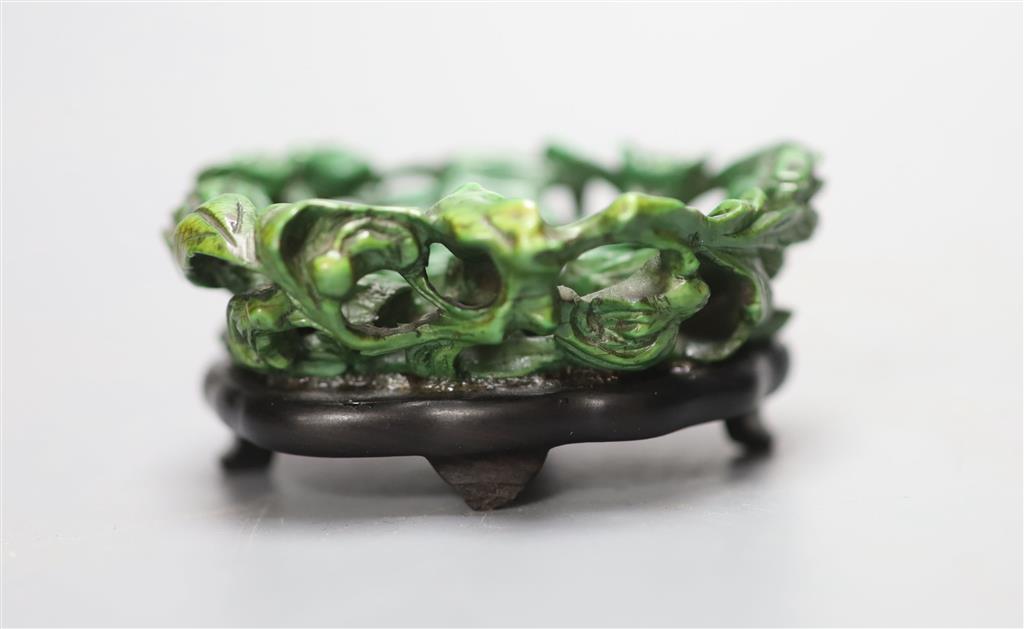 An 18th century Chinese green stained ivory and hardwood stand, 5.7cm